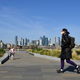 A woman walks in Greenwich, south east of London, on March 24, 2020 after Britain’s government ordered a lockdown to slow the spread of the novel coronavirus.